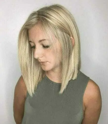 Woman with a blonde lob haircut aka long a-line haircut, one of the different types of bobs.