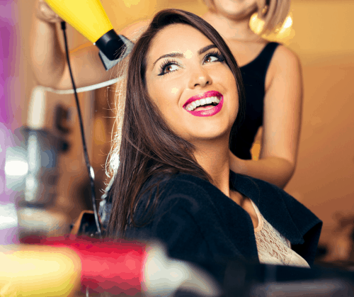 Woman getting her hair done in a salon.