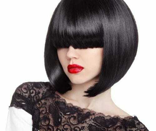 Woman with a black typical bob haircut, one of the different types of bobs. 