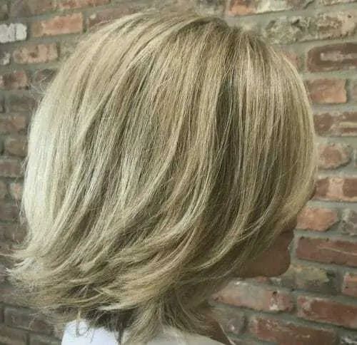 Woman with a layered bob, one of the different types of bobs.