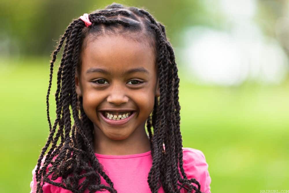 Young African American little girl with 4a hair texture with braided long hair