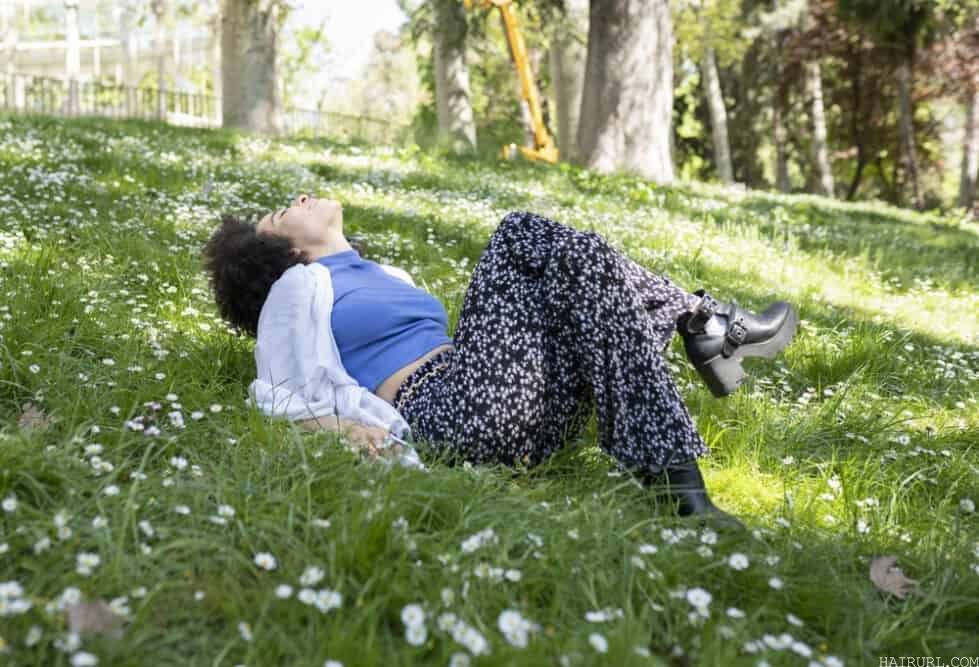 Woman relaxing outside after a waxing treatment to prevent ingrown hairs